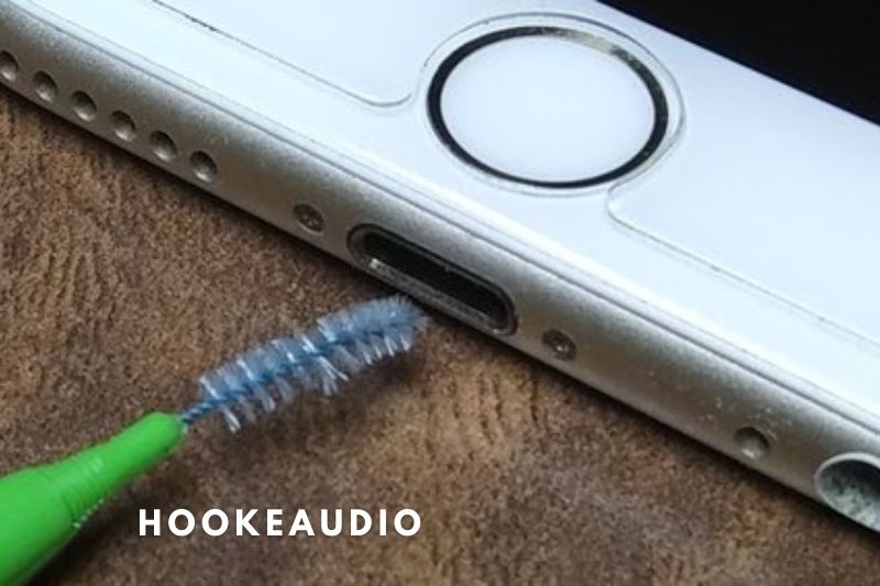 6. A soft bristles brush may also be used to clear extra dust from the bottom speaker holes near the charging port.